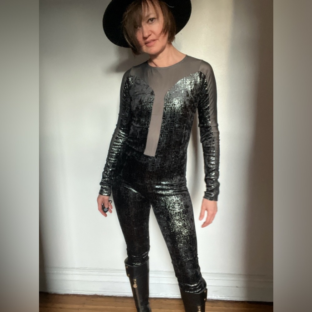 Killer long sleeve black and metallic silver jumpsuit. Size small. Open back.
